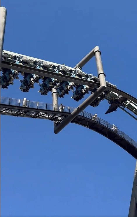 Terrifying footage shows 32 passengers dangling upside down after the Flying Dinosaur roller coaster at Universal Studios Japan in Osaka broke down mid-ride today