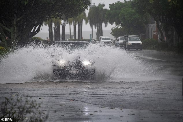 Heavy rain and flash flooding are expected to continue around Far North Queensland from Thursday to Friday (pictured in Cairns)