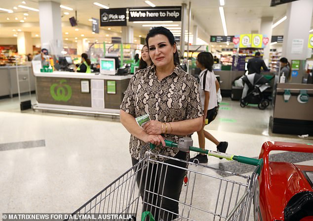 Aussies are seeing the cost of essentials like groceries rising.  Stock image of a woman in Woolworths