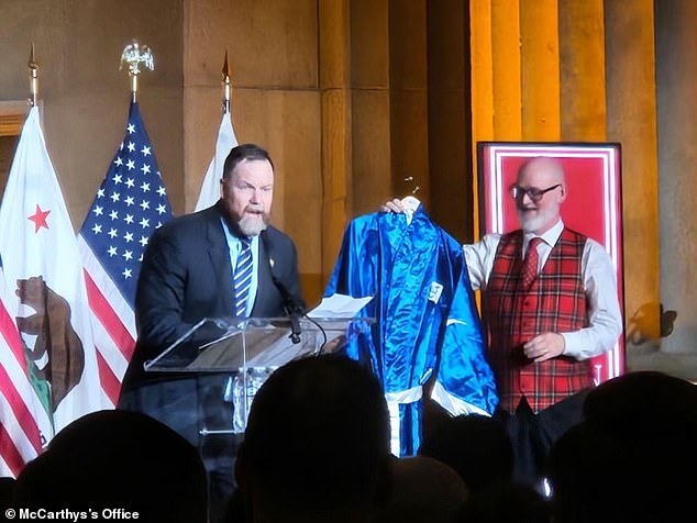 McCarthy received a boxing jacket as a gift from Reps. Aaron Bean, R-Fla., and Derrick Van Orden, R-Wis.