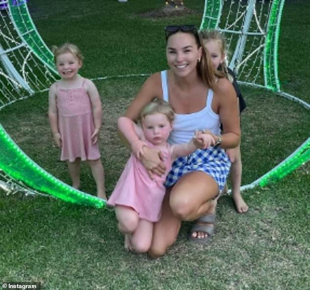 McKinnon and Power share three children: Harriet, four, and twins Audrey and Violet, two (pictured with their mother)