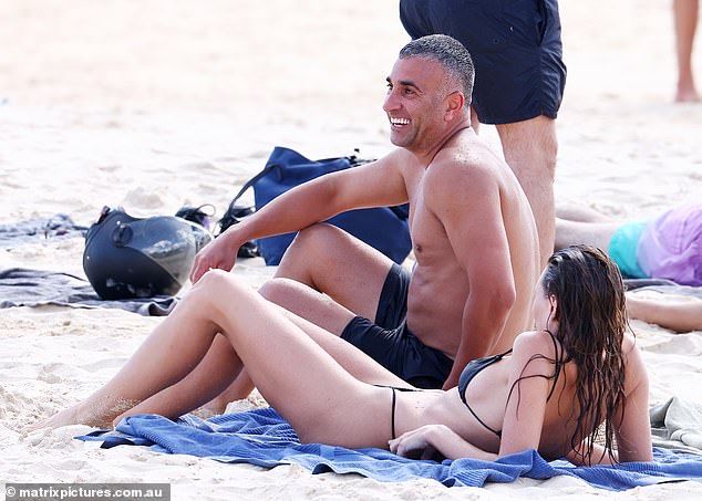 After taking a refreshing dip, Montana and her swimming partner lay down on the sand and chatted