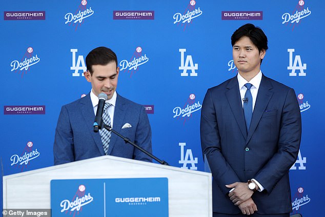 Ohtani wore a blue tie in his new team's colors after transferring from the rival Angels