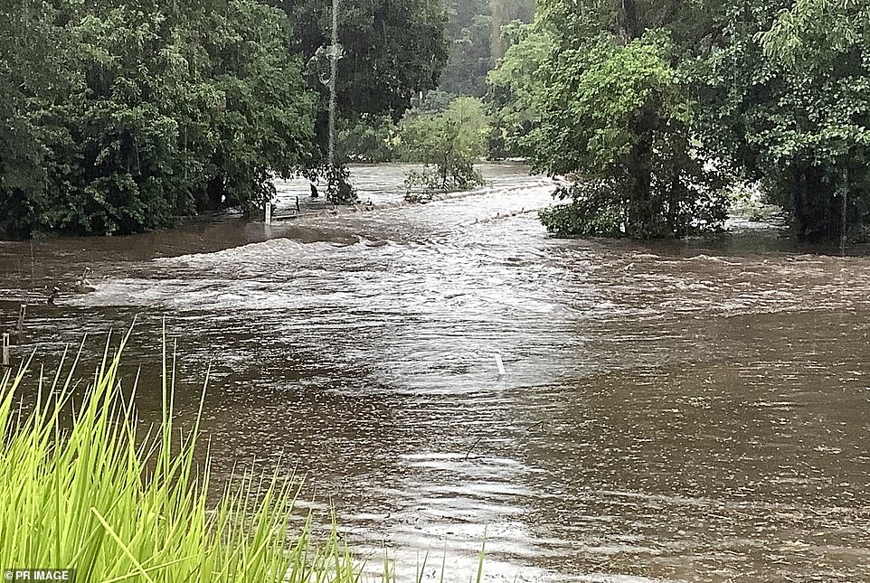 The Mossman River overflowed its banks early Friday morning, causing heavy flooding of the streets