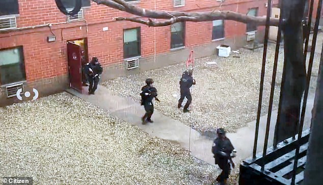 Footage from the Eldridge St scene posted on the Citizen app shows several NYPD officers with long guns surrounding a building