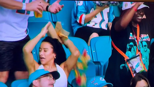 The wife of Miami Dolphins wide receiver Tyreek Hill had nachos spilled on her during a game