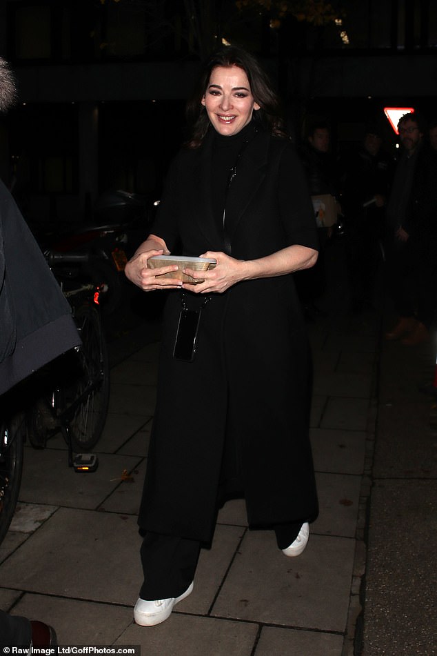 Nigella beamed from cheek to cheek as she appeared in high spirits as she braved the freezing streets of London