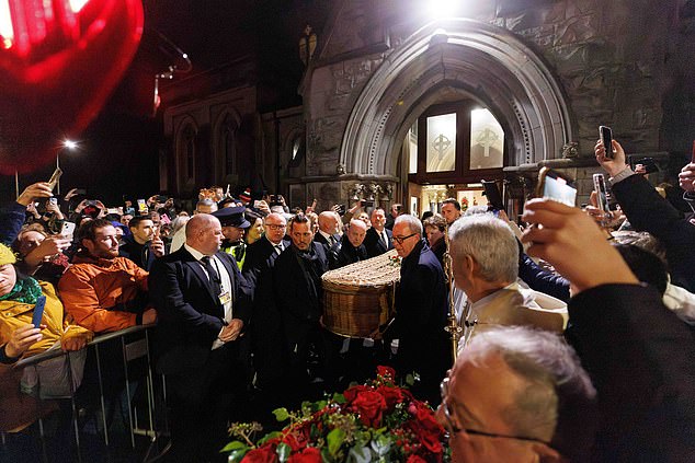 Johnny Depp carries his friend's coffin during the funeral at St Mary's Church, Nenagh, Co Tipperary