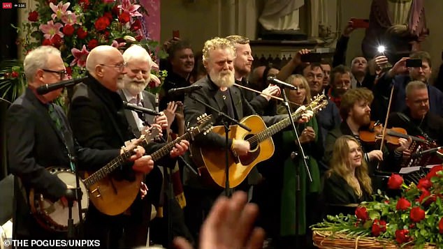 Former members of The Pogues - Jem Finer, Terry Woods, Spider Stacey and James Fearnley - perform one of the service's final songs