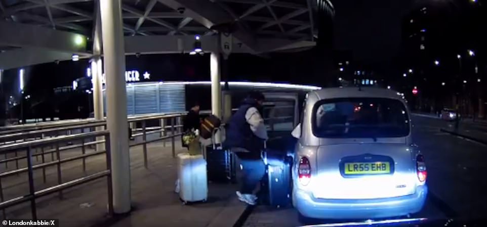 With the couple's backs turned, the thief suddenly comes up behind him and steals the suitcase