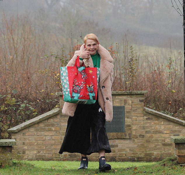 Jackiey clutched a bag full of graveside decorations as he headed home