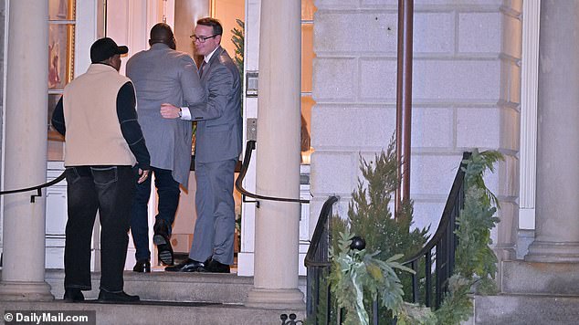 Unknown guests are greeted as they arrive at the Electeds of Color Holiday party