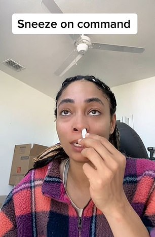 In February, Jess, a creator from Florida, shared a video of herself sticking a twisted piece of toilet paper up her nose to sneeze.  'Let it touch the back of your nostrils'