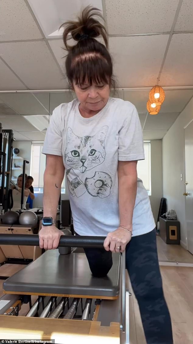 the Hot in Cleveland star wore a comfortable-looking gray T-shirt with a picture of a cat and coffee on it and black and green camo leggings for her fitness routine