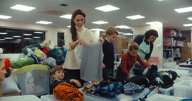 The Welsh children helped their mother and volunteers choose donations and make boxes for children in need at Christmas.  From left: Louis, Kate, George and Charlotte