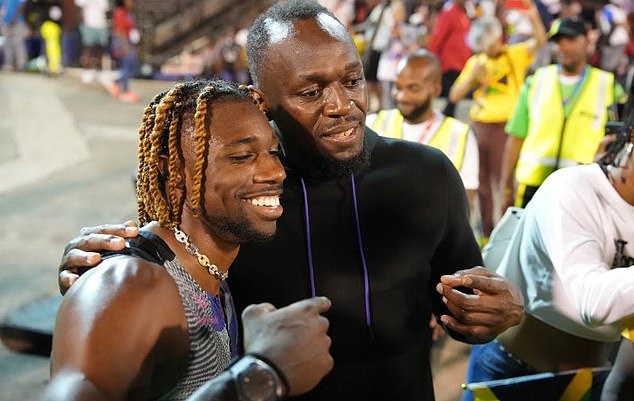 Lyles with athletics legend Usain Bolt during the Racers Grand Prix in Jamaica, in June 2023