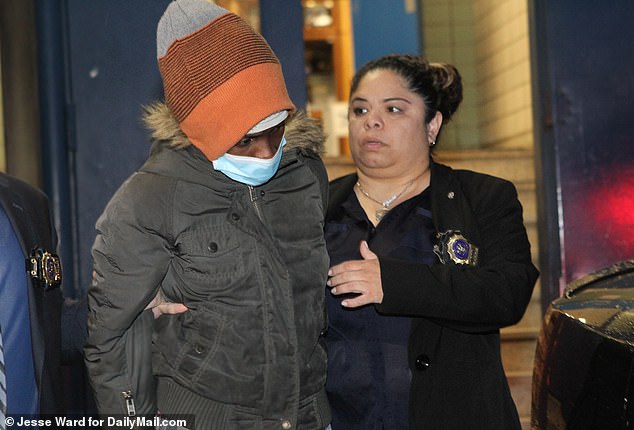 Police arrived on the scene in Crown Heights just after 1 p.m. and attempted to revive Cato's daughter.  Pictured: Cato, 48, leaving the 77th Precinct Station in Brooklyn