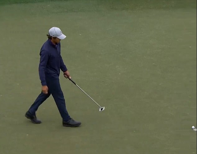 Charlie, 14, makes a birdie putt in a manner that has become synonymous with his father