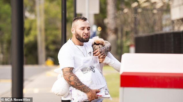 Her partner helped her with another bag of belongings as she left Silverwater Correctional Complex in Sydney's west