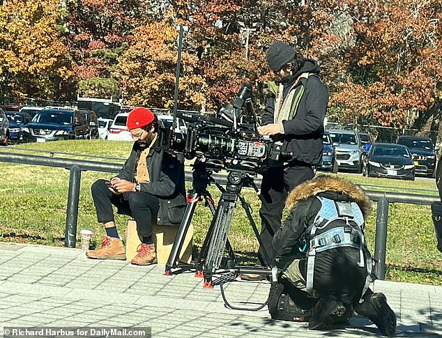 Ellerup agreed to take part in the mega deal with NBC's streaming service Peacock, which will see a crew film her family during her husband's trial.  Pictured: Television crew outside the Suffolk County Supreme Court, where Heuermann had a hearing on Nov. 15