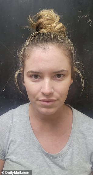 Chills in her booking photo after her arrest