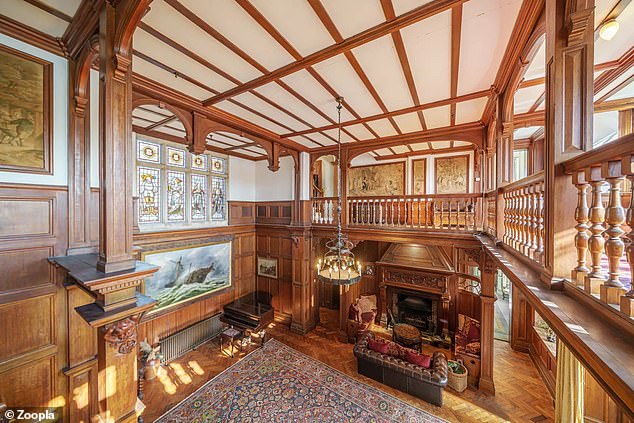 The house features a double-height Baronial reception room, with paneling reused from the House of Lords where a renovation was underway at the time.