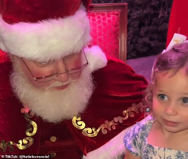 Normally, children sit on Santa's lap for photos, but Adley had a different idea: He gave a firm 