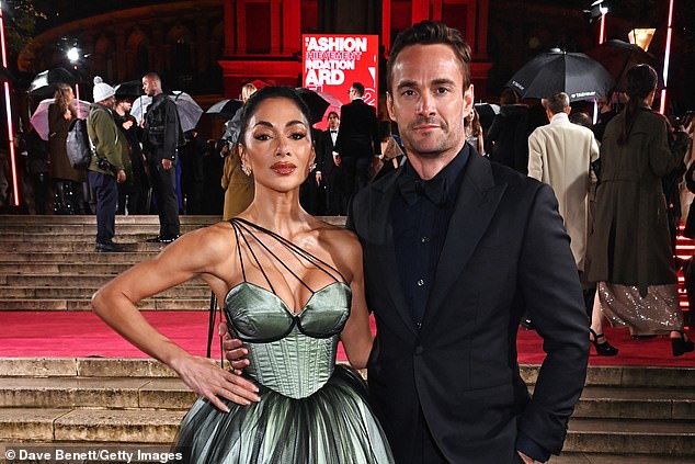 Thom Evans, pictured with fiancée Nicole Scherzinger, praised Robson's actions after he was seriously injured in a tackle against Wales in 2010