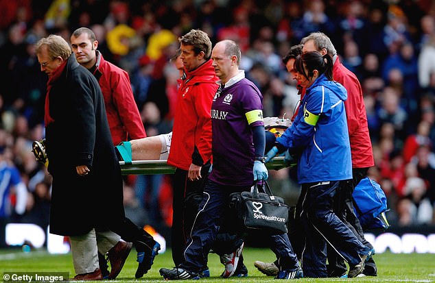 Evans credits Robson, center, with saving his life after holding him in the position he fell in to prevent him from breaking his neck