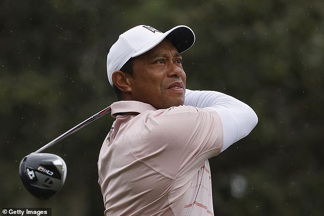 Woods appeared injury free as he walked the course alongside both of his children