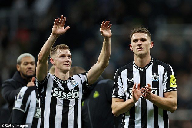 Emil Krafth (L) and Sven Botman of Newcastle United celebrate after the team's victory