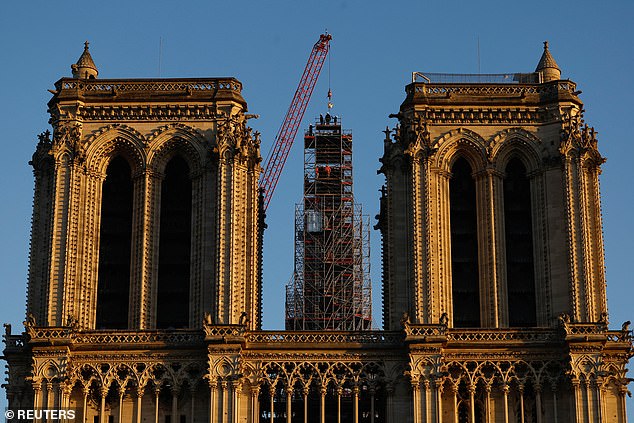 It symbolizes resilience amid the devastation following the devastating fire of April 2019 - when restoration officials also revealed that an anti-fire fogging system is being installed under the cathedral's roof