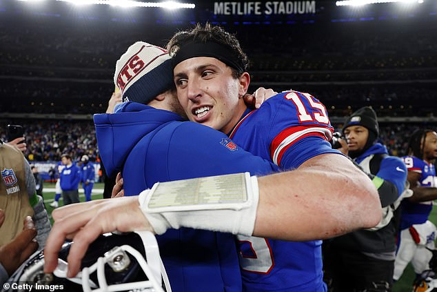 Tommy DeVito hugs family after helping the Giants beat the Green Bay Packers on Sunday