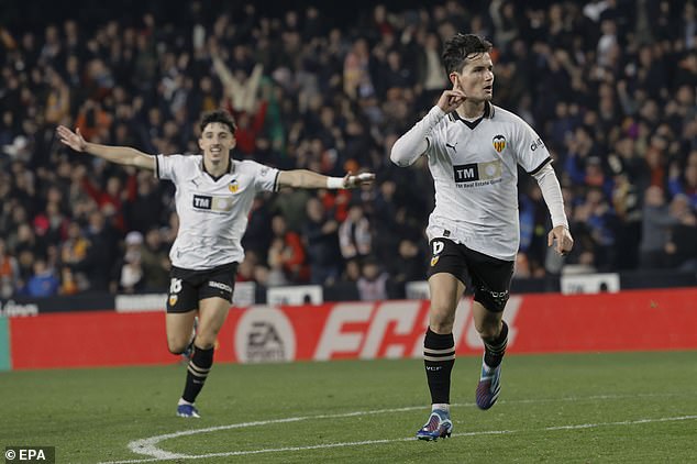 Hugo Guillamon's (right) late goal secured a late draw for the hosts in Valencia