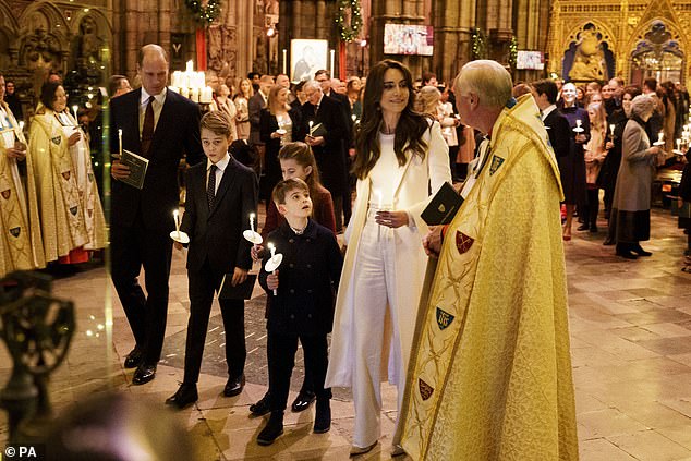 The Royal Family speaks with the Reverend David Stanton as they arrive at Westminster Abbey