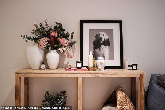 Flowers and designer candles decorate the star's living area, making everything smell and look luxurious