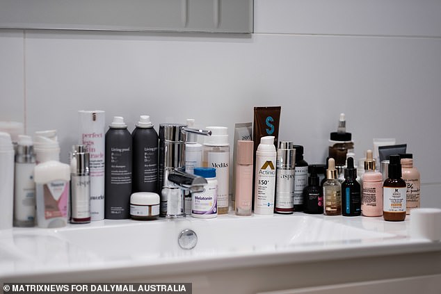 The bathroom cabinet is littered with high-quality skin care from brands such as Aspect and Medik8