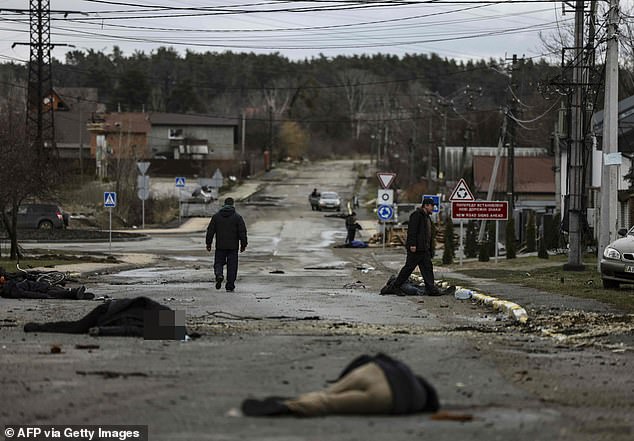 Bodies lie in a street in Bucha, northwest of Kiev, as Russian forces carried out an attack "quick retreat" from northern areas around Kiev and Chernigiv city, on April 2, 2022