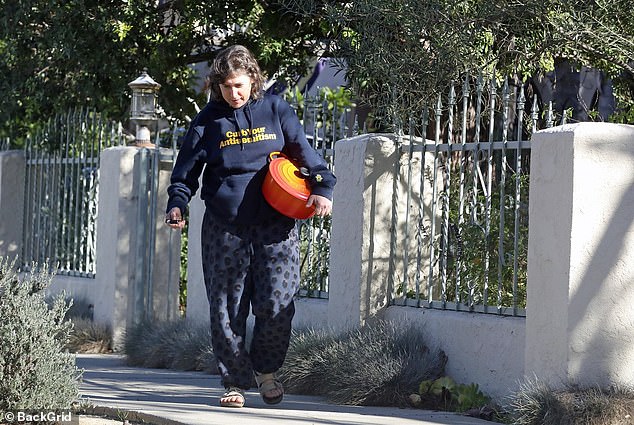 She was spotted strolling down the street in a pair of tan suede slip-on sandals while running errands