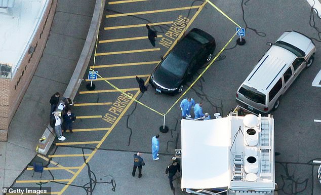 Police are seen outside Sandy Hook school on December 14, 2012, immediately after the shooting