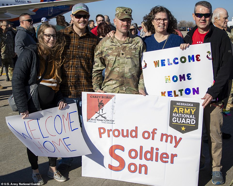 Families waited patiently on the asphalt for their loved ones to return home safely