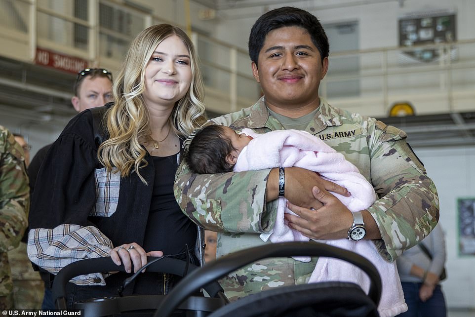 One of the soldiers who came home during the holidays was Matias Domingo, who met his daughter for the very first time.  He is pictured next to his wife Brianne