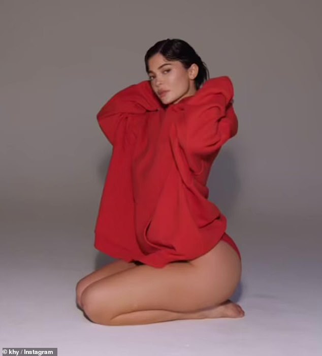 The 26-year-old reality TV personality modeled a bright red, oversized hoodie and just a pair of cheeky underwear as she posed in a clip shared to her brand's official Instagram page