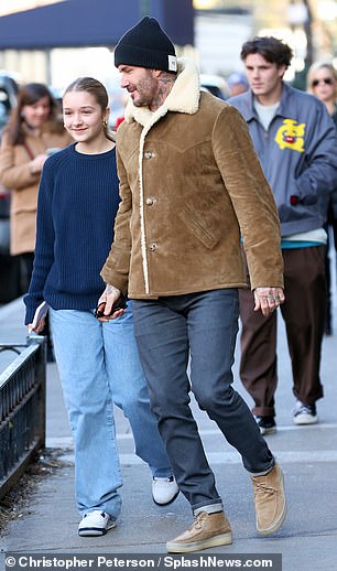 David looked stylish as ever in a suede shearling jacket, which he teamed with dark jeans, a navy blue beanie and a pair of suede lace-up boots