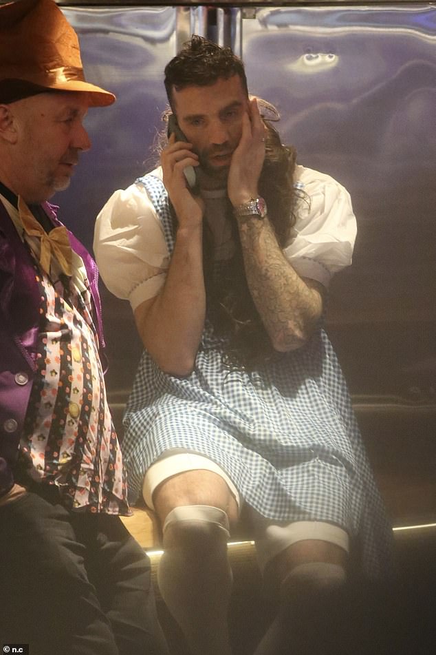 Shane wore his fetching Dorothy dress with a matching dark brown wig