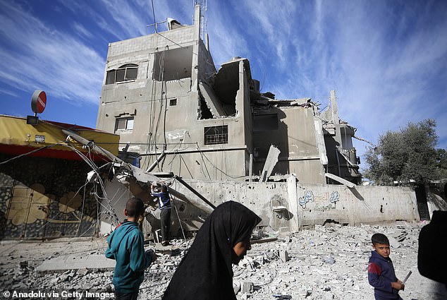 A view of a partially destroyed building belonging to the Beshir family located on Salah al-Din Road following Israeli attacks in Gaza City, Gaza on December 16