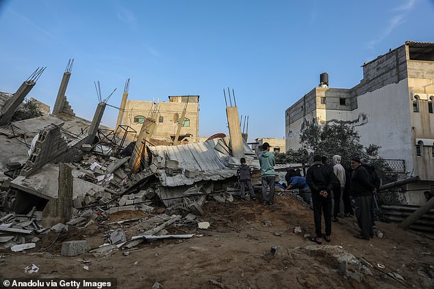 Civil defense teams conduct search and rescue operations among the rubble of destroyed buildings after the Israeli airstrike in Rafah, Gaza on December 17