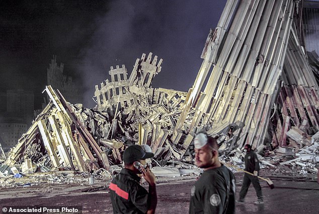 First responders work at ground zero after the September 11 attacks in New York