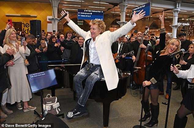 Stewart can be seen during a surprise performance at London's St Pancras station on December 5