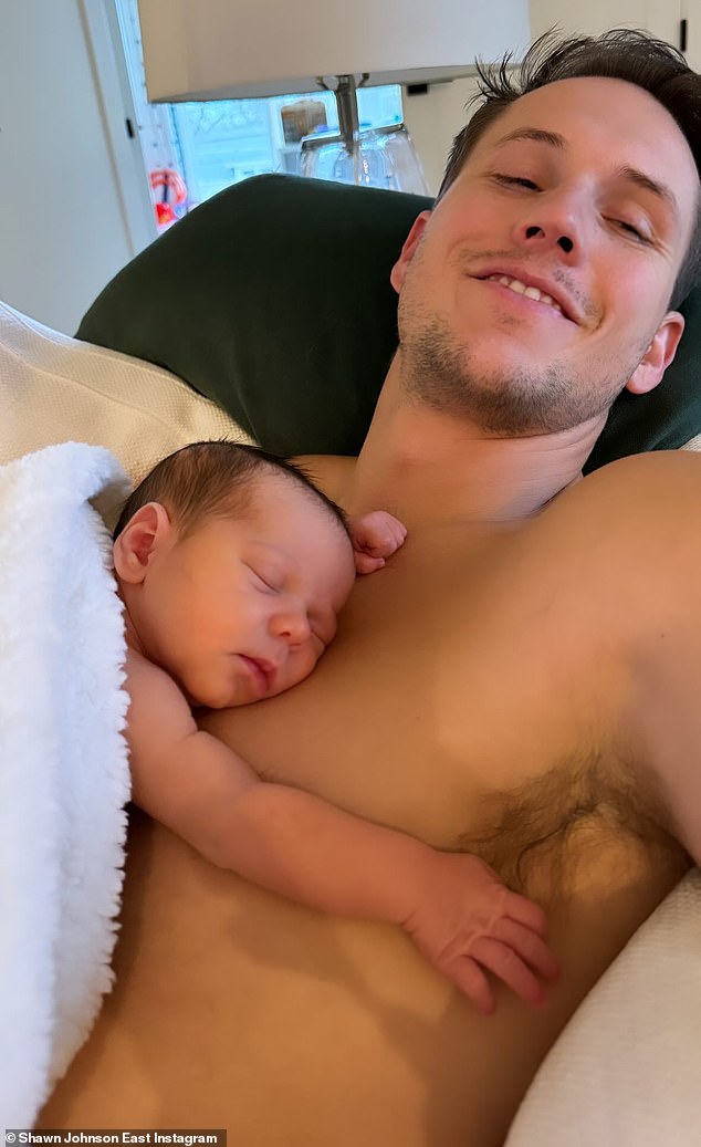 The gymnast then posted a photo showing Bear resting on the chest of his father, Andrew East